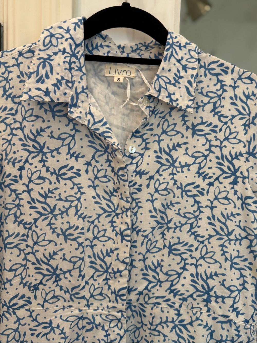 Women’s maxi blue floral button up dress.